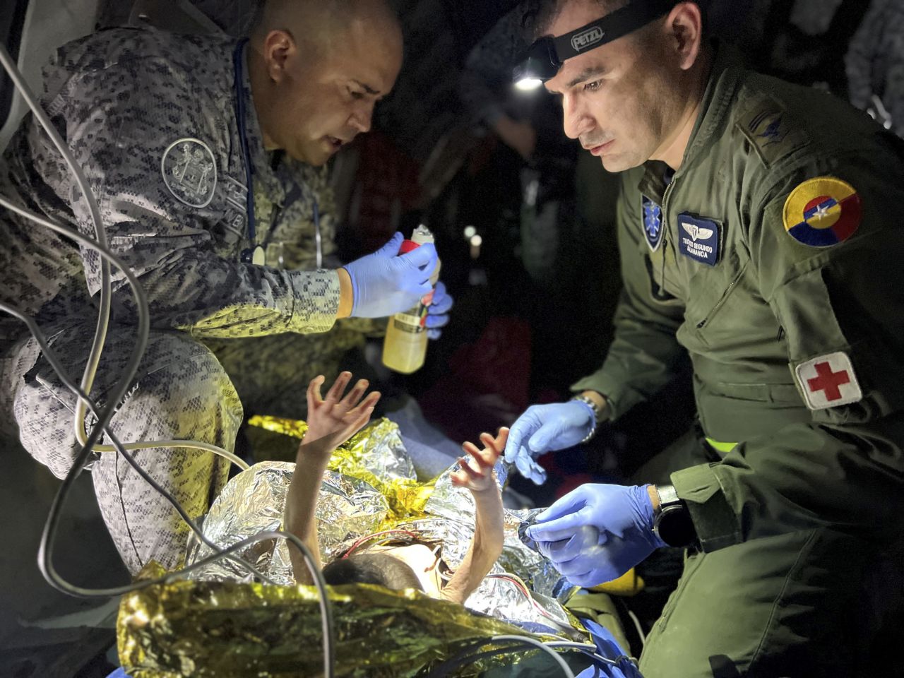 Members of the Colombian Air Force give medical attention to a child Friday, June 9, aboard a plane in San José del Guaviare, Colombia. Four children, ranging in age from 1 to 13, <a href="https://www.cnn.com/2023/06/12/world/colombia-amazon-plane-crash-survivors-grandfather-interview-intl-hnk/index.html" target="_blank">were found alive in the Amazon jungle more than a month after their plane crashed</a>, officials said. Their mother was killed in the crash, as was the pilot and another passenger.