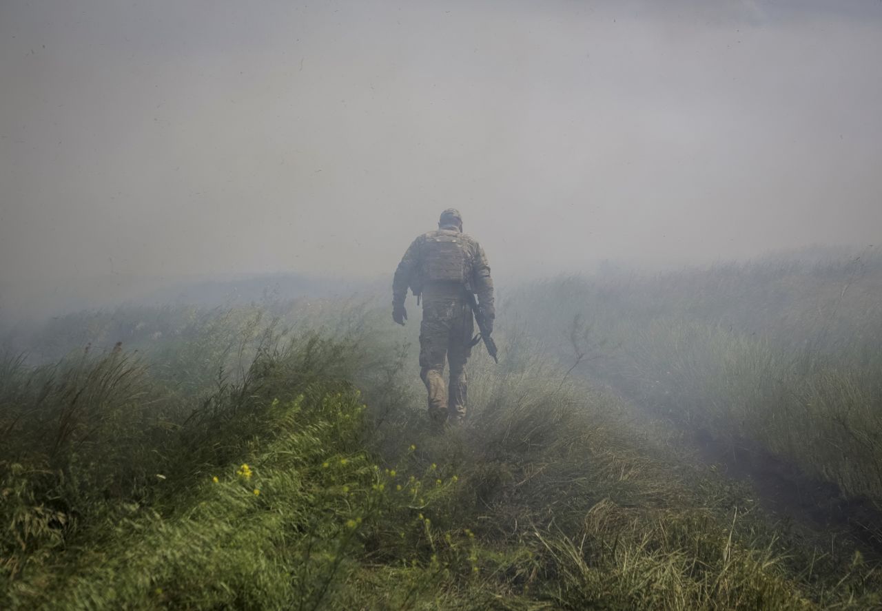 A Ukrainian service member walks Tuesday, June 13, near the village of Neskuchne, which was <a href="https://www.cnn.com/2023/06/14/europe/ukraine-russia-war-velyka-novosilka-frontline-intl/index.html" target="_blank">recently liberated from Russian forces</a>.