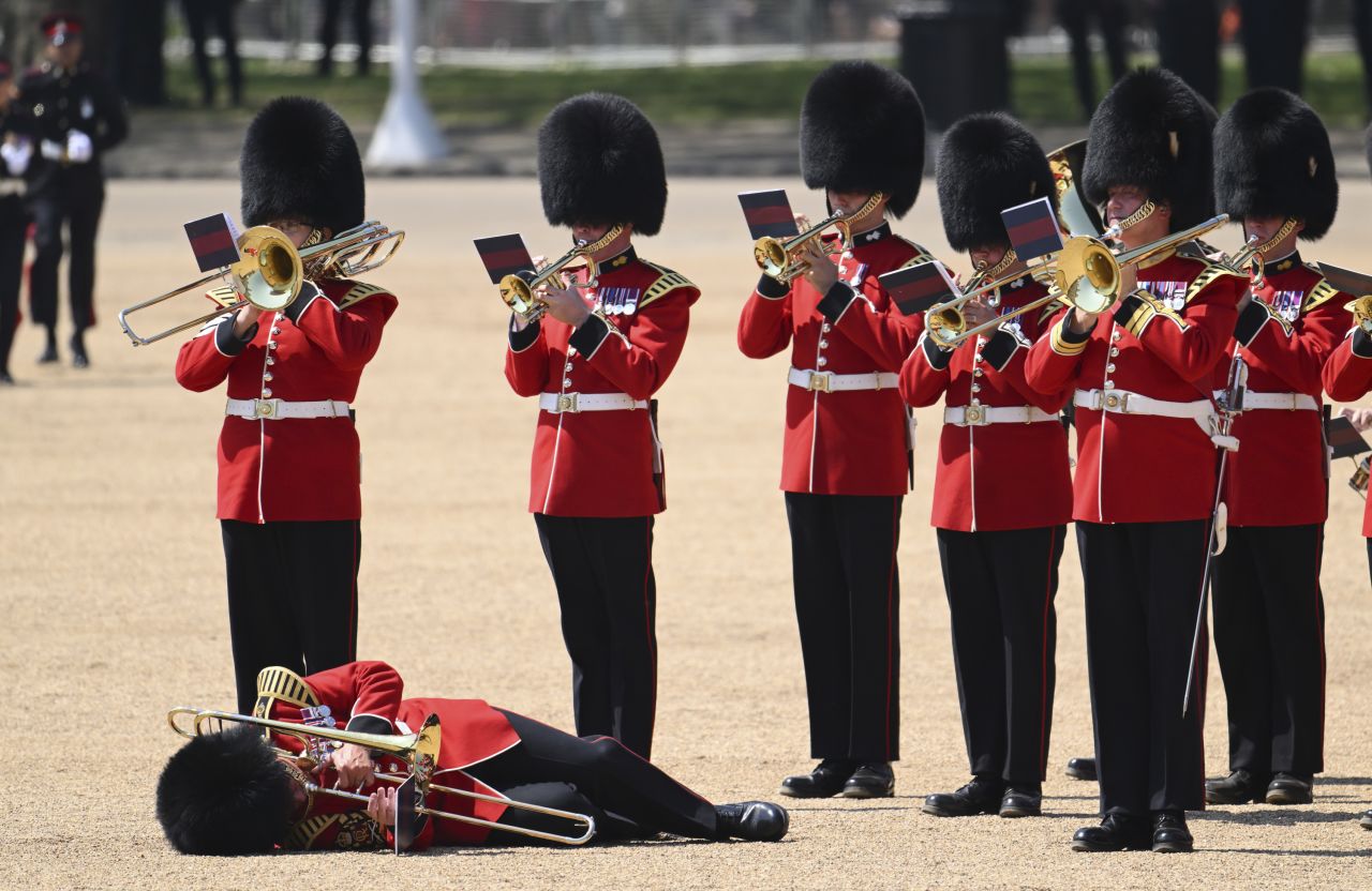 A member of the Band of the Welsh Guards faints in the hot weather as Britain's Prince William carries out The Colonel's Review in London on Saturday, June 10. At least three guardsmen fainted during the military parade, according to the Associated Press.