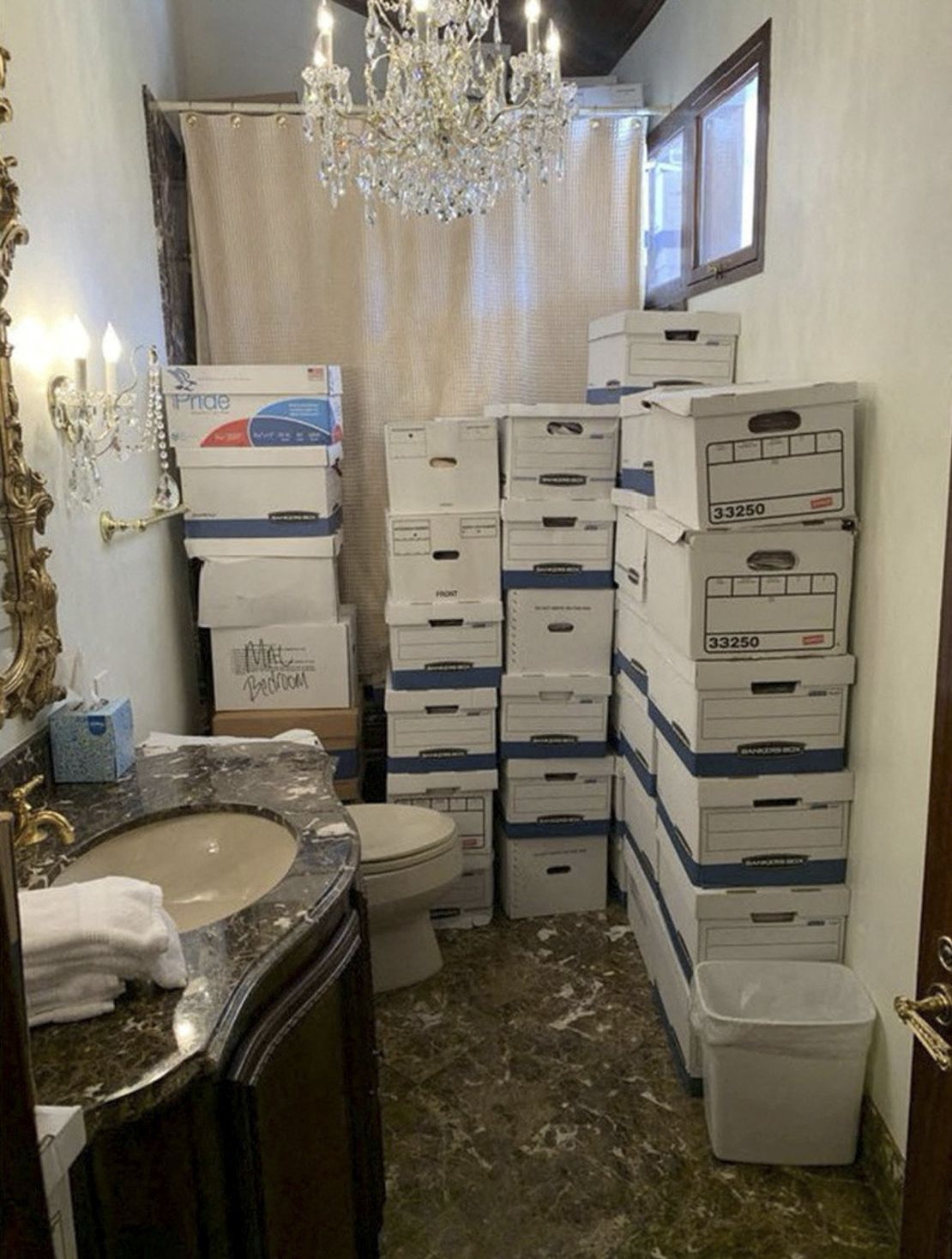 A photo released by the Department of Justice shows boxes of documents stored in a bathroom at Trump's Mar-a-Lago club in Florida in early 2021.