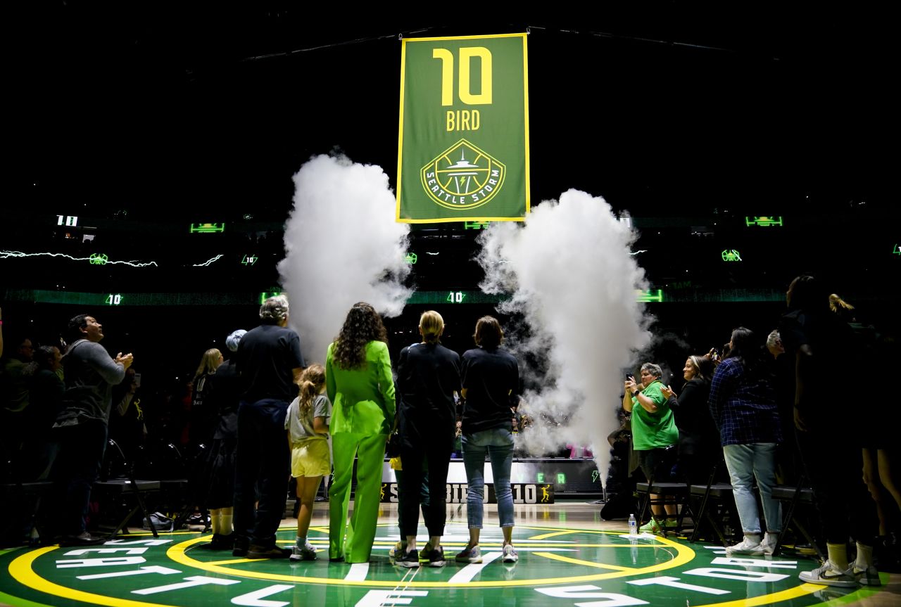 Former WNBA star Sue Bird, seen here in green, has her jersey number retired by the Seattle Storm on Sunday, June 11.