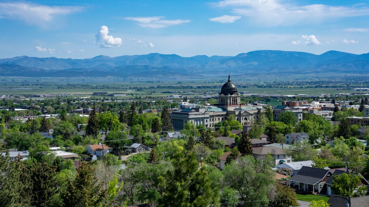 Montana's state capitol building rises above Helena, even as it is dwarfed by mountains.