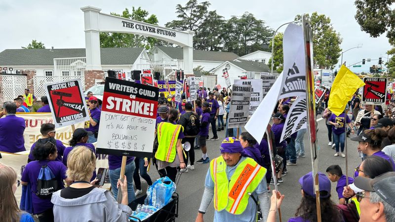 NextImg:Janitors who lost jobs during WGA strike join picket line | CNN Business