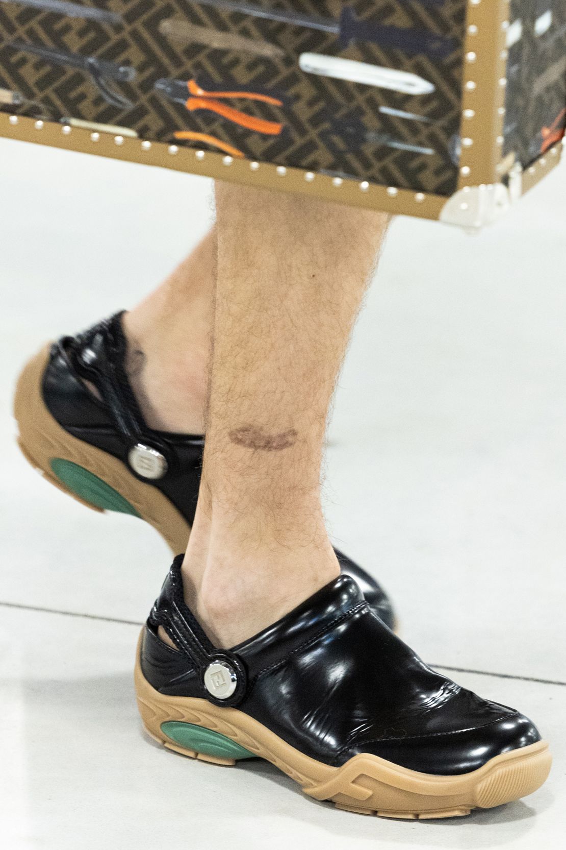 FLORENCE, ITALY - JUNE 15: A model, shoe detail, walks the runway at the Fendi Men's SS24 Fashion Show at Fendi Factory on June 15, 2023 in Florence, Italy. (Photo by Pietro D'Aprano/Getty Images)