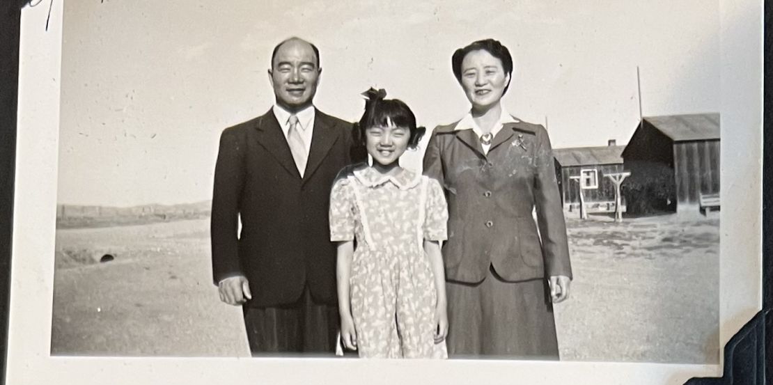 Amy Iwasaki Mass was a first grader when her family was forced to live in an internment camp in Wyoming. Here she poses with her parents while incarcerated.