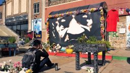 A man who preferred not to give his name takes a moment at the George Floyd memorial during the annual Rise and Remember Festival near the place where Floyd was murdered three years ago by a police officer, in Minneapolis, Minnesota, U.S., May 27, 2023.