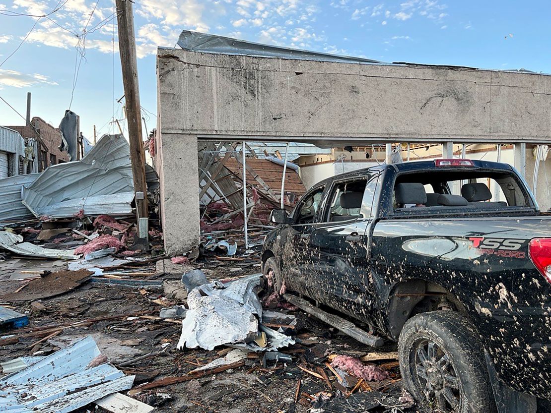 Buildings and a vehicle are damaged after a tornado in Perryton, Texas, Thursday.