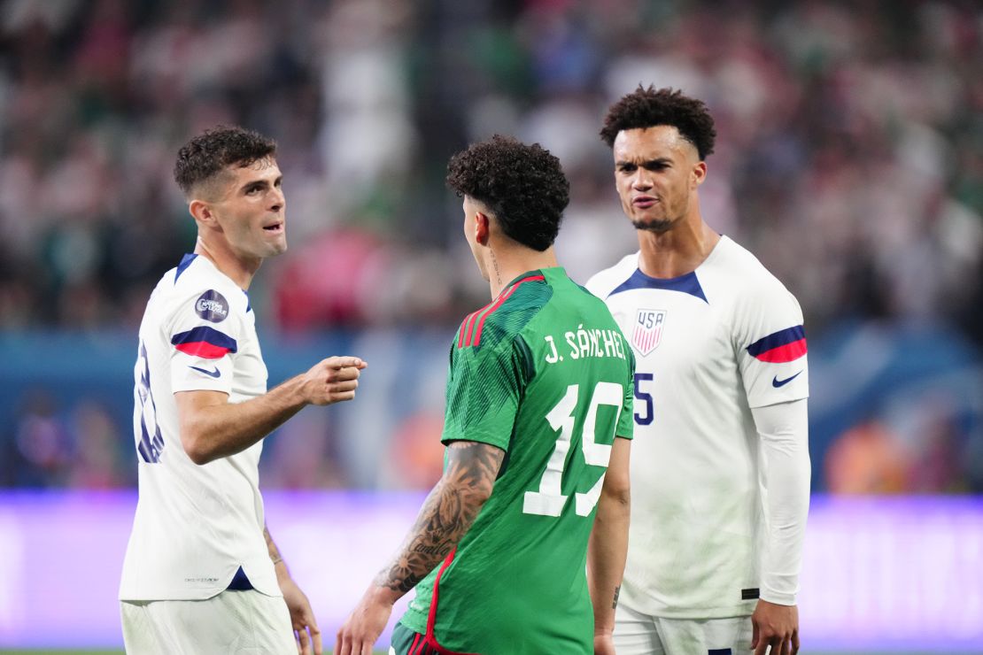 LAS VEGAS, NEVADA - JUNE 15: Christian Pulisic #10 and Antonee Robinson #5 gestures at Jorge Sanchez #19 of Mexico during the second half during the 2023 CONCACAF Nations League semifinals at Allegiant Stadium on June 15, 2023 in Las Vegas, Nevada. (Photo by Louis Grasse/Getty Images)