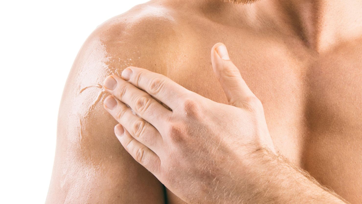 A man applies testosterone gel.  Men in the study received a daily testosterone gel or a placebo for an average of 22 months.