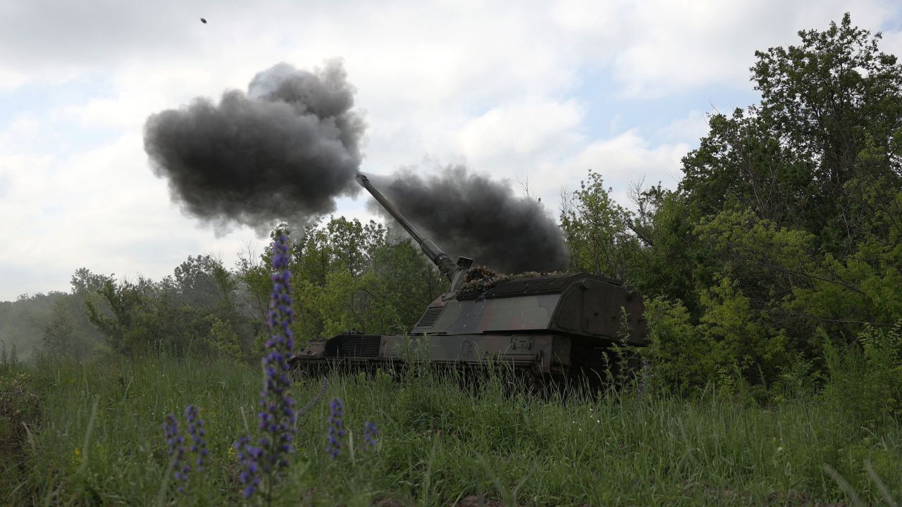 Ukrainian servicemen of the 43rd Artillery Brigade fire a howitzer toward Russian positions near Bakhmut on June 15.