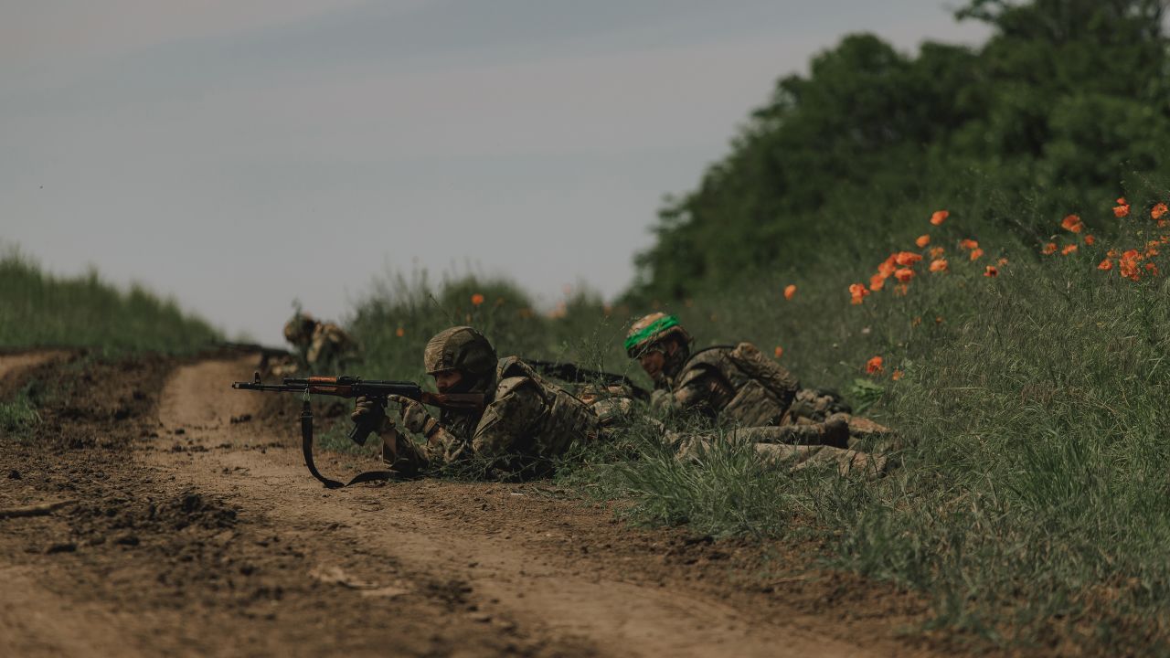 Ukrainian soldiers stand by the roadside during training for an operation near Bakhmut on June 1.