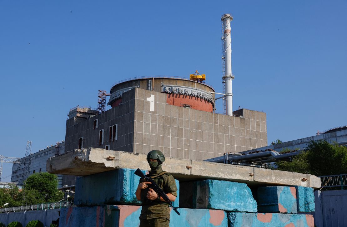 A Russian service member stands guard at a checkpoint near the Zaporizhzhia Nuclear Power Plant in Russian-controlled Ukraine on June 15.