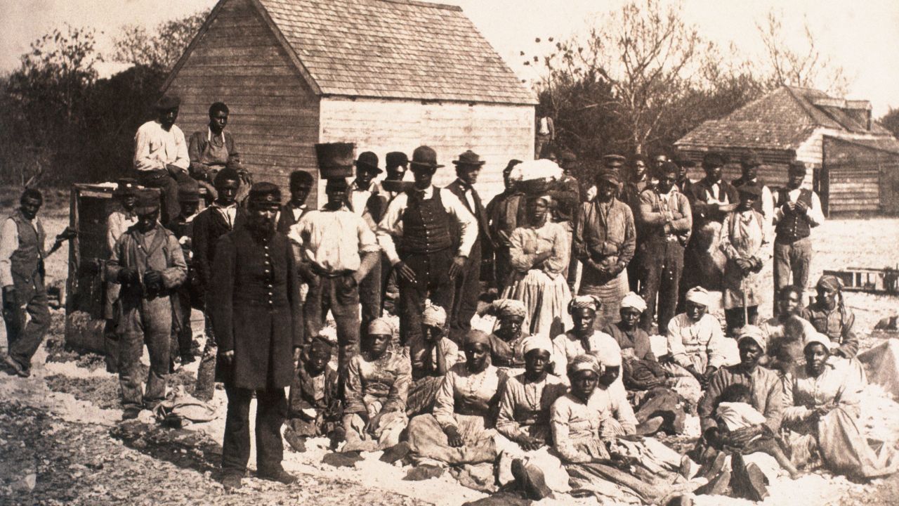 A group of freed slaves gather on the plantation of Confederate general Thomas F. Drayton in Hilton Head, South Carolina, during the Union occupation of the property, 1862. (Photo by © CORBIS/Corbis via Getty Images)