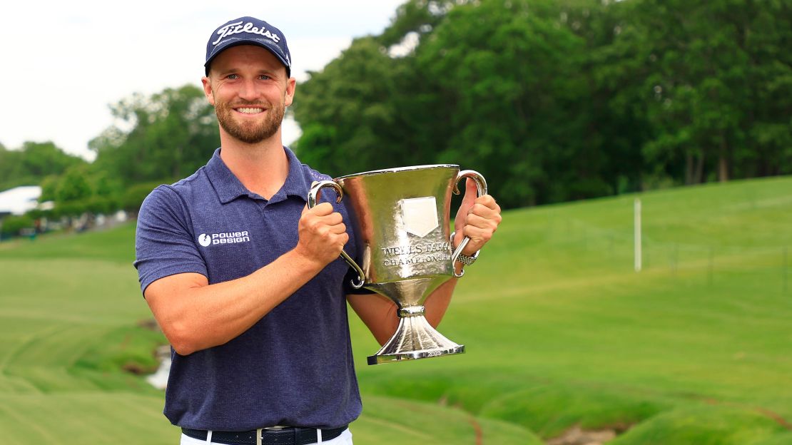 Wyndham Clark celebrates with the trophy after winning the Wells Fargo Championship on May 07, 2023 in Charlotte, North Carolina.