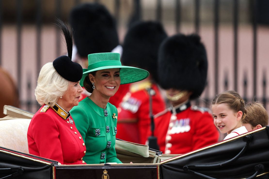 Queen Camilla, left, and Catherine, Princess of Wales greet crowds outside Buckingham Palace.