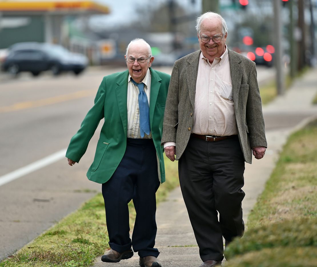 Brothers Donald, left, and Oliver Triplett take a walk in Forest, Mississippi.