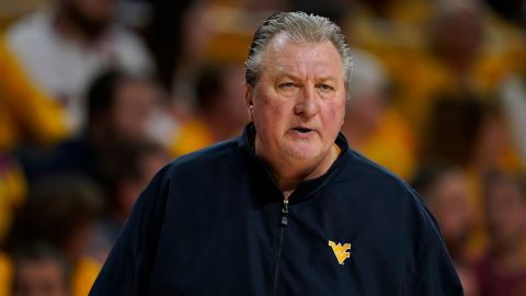 West Virginia head coach Bob Huggins watches from the bench during the first half of an NCAA college basketball game against Iowa State, Monday, Feb. 27, 2023, in Ames, Iowa.