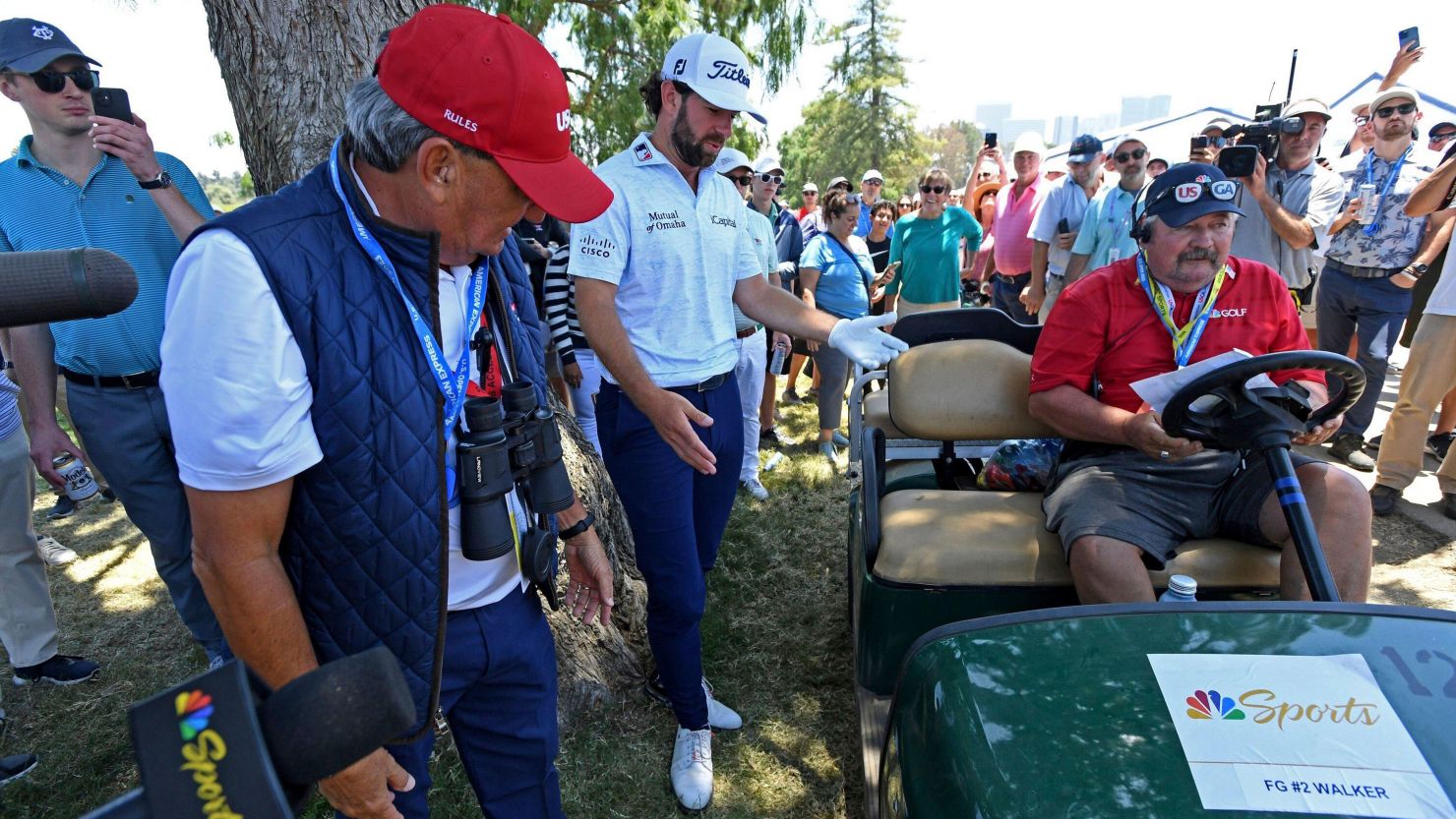 Cameron Young and course officials figure out what to do with Young's errant shot of the 10th fairway during the third round for the 2023 U.S. Open at the Los Angeles Country Club in Los Angeles on Saturday June 17, 2023.   Photo by Mike Goulding/UPI (Alamy Live News via AP)