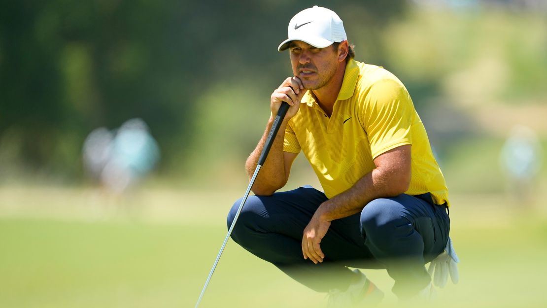 Brooks Koepka lines up a putt during the third round.