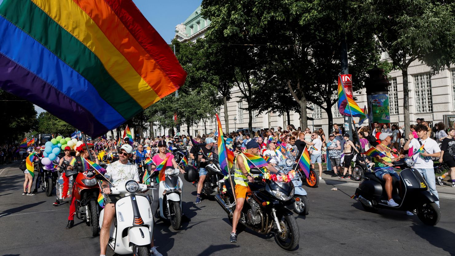 People ride motorbikes and scooters during a march to celebrate LGBTQ+ rights at the annual pride parade in Vienna, Austria, June 17, 2023.