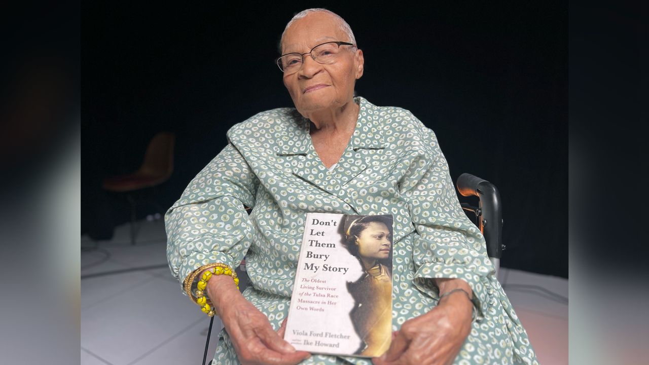 Viola 'Mother Fletcher' Fletcher, 109, holds a copy of "Don't Let Them Bury My Story," a memoir she cowrote with her grandson Ike Howard.