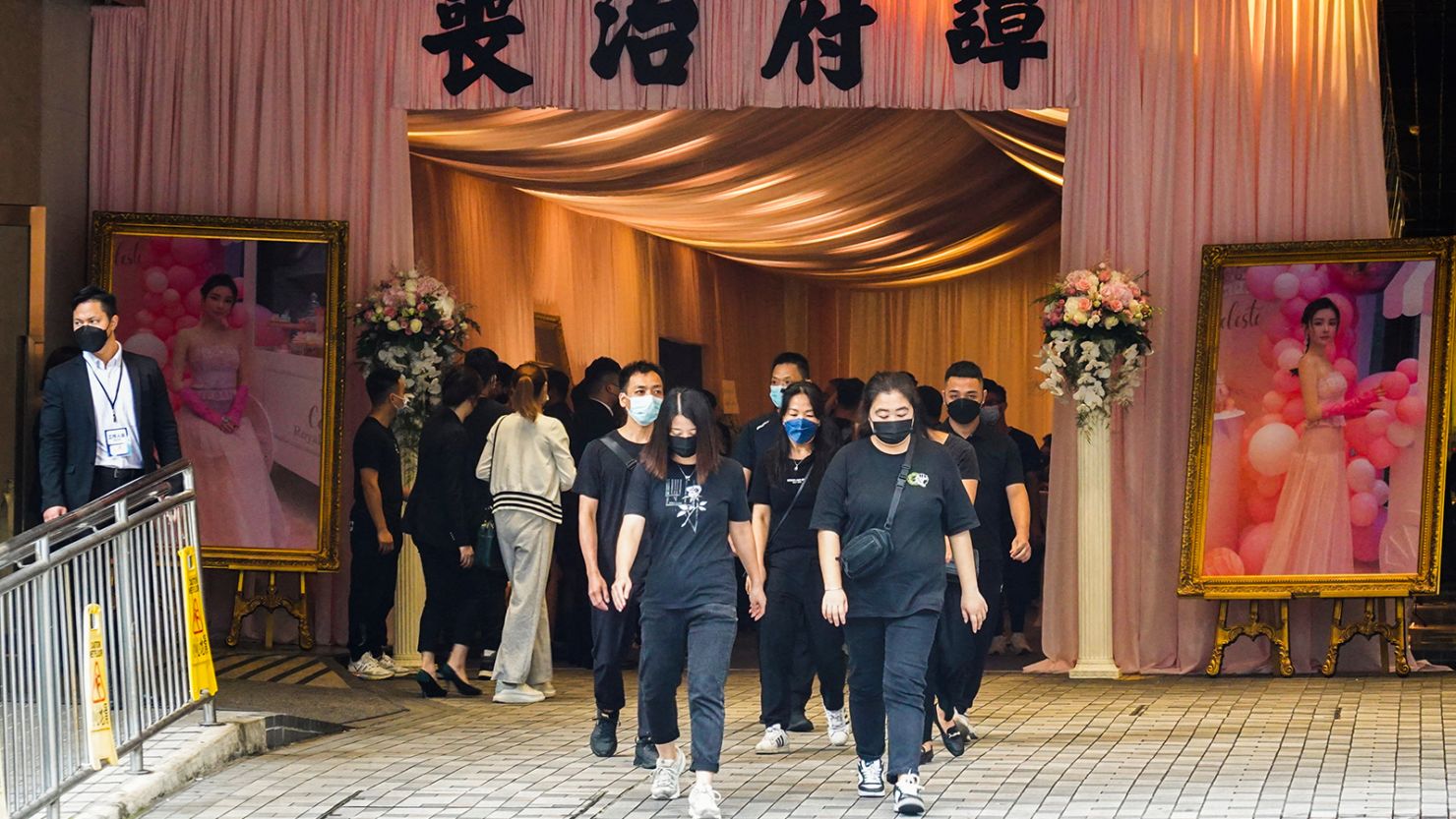 Mourners leave the memorial hall during the funeral of model Abby Choi in Hong Kong on June 18, 2023.