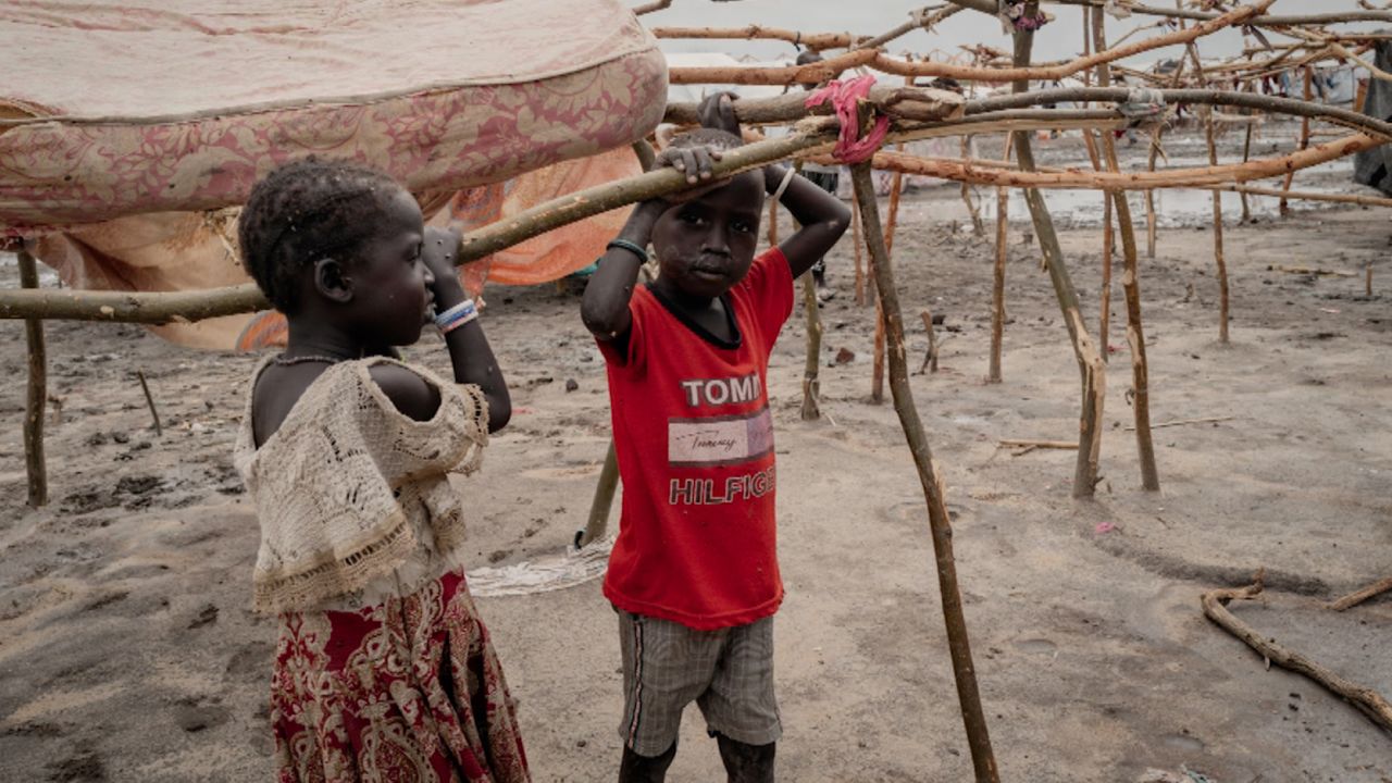 Families with children are staying in rudimentary shelters as they wait for a more permanent place to settle.