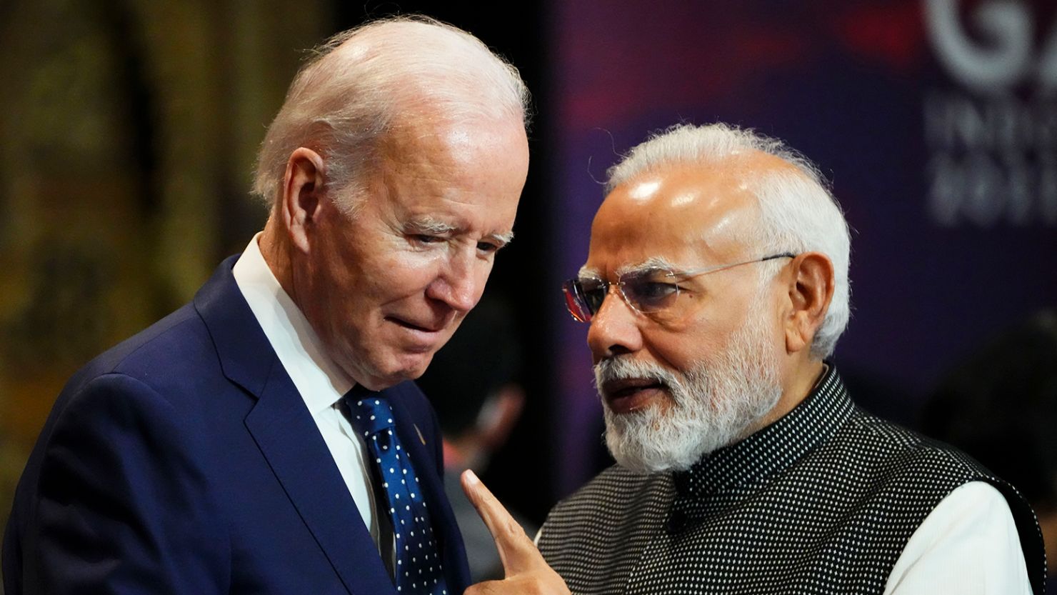 India's Prime Minister Narendra Modi talks with US President Joe Biden as they arrive for the first working session of the G20 leaders summit in Bali, Indonesia, Nov. 15, 2022.