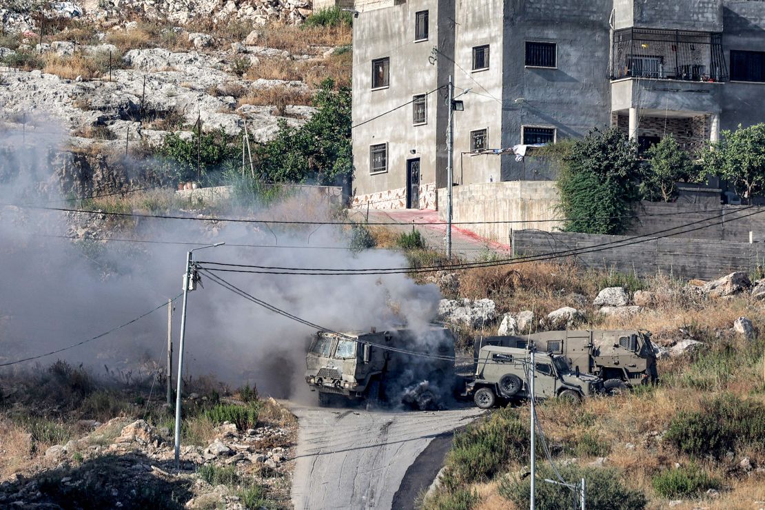 Smoke billows over the occupied West Bank city of Jenin Monday, where heavy fighting broke out following an Israeli incursion.