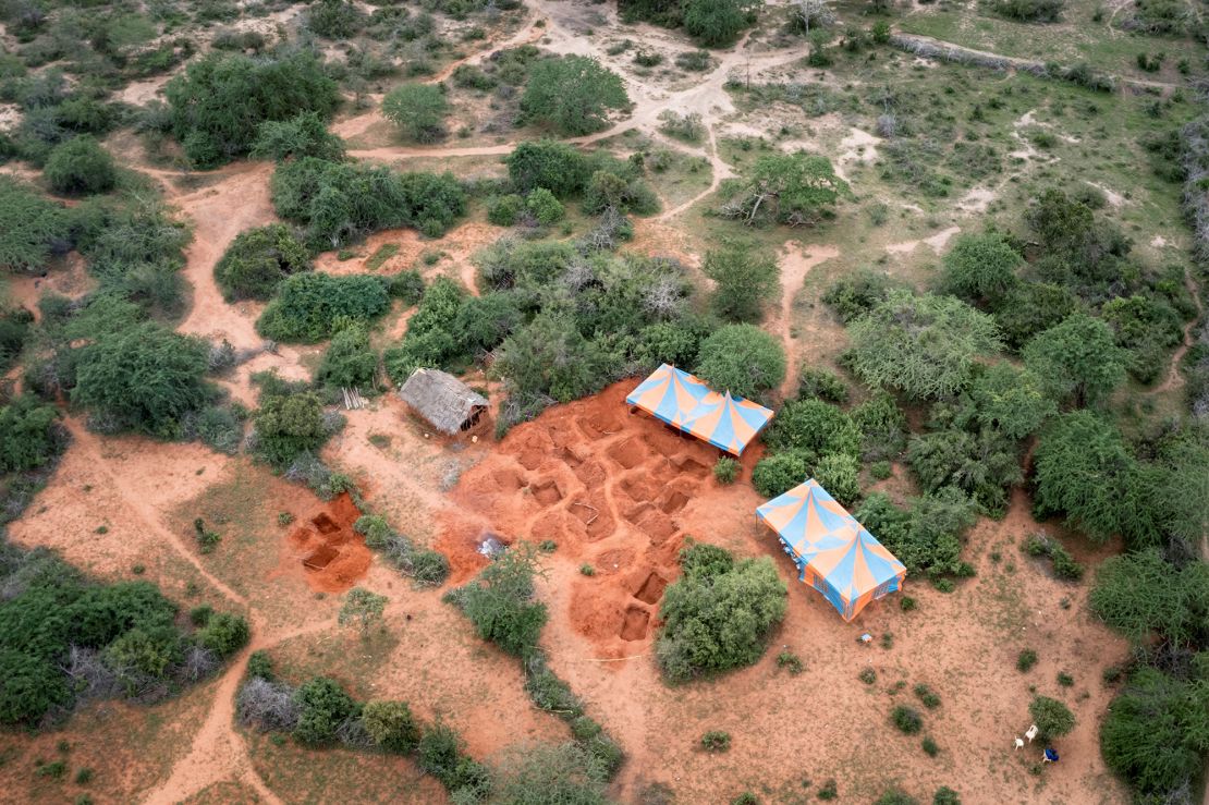 An aerial view shows the mass-grave site in Shakahola, outside the coastal town of Malindi, on April 25, 2023. The death toll in an investigation linked to a Kenyan cult that practised starvation has climbed to 201, as investigators on May 13, 2023 unearthed 22 more bodies from a coastal forest, a government official said. (Photo by Yasuyoshi Chiba / AFP) (Photo by YASUYOSHI CHIBA/AFP via Getty Images)