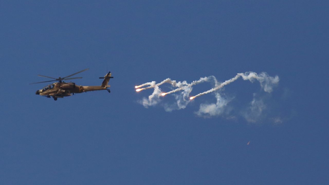 An Israeli military helicopter fires flares on Monday.