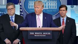 US President Donald Trump speaks, flanked by Defense Secretary Mark Esper (R) and US Attorney General William Barr (L), during the daily briefing on the novel coronavirus, COVID-19, in the Brady Briefing Room at the White House on April 1, 2020, in Washington, DC.
