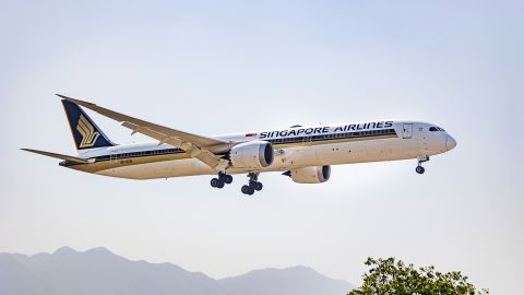 Singapore Airlines Boeing 787-10 Dreamliner, the largest and longest variant of the 787 passenger aircraft as seen flying over the mountains of Kathmandu valley and landing in Tribhuvan International Airport KTM. The modern and advanced arriving wide body airplane the B787 has the registration 9V-SCN and is powered by 2x Rolls Royce RR jet engines. Singapore Airlines SIA is the flag carrier airline of Singapore with its hub at Singapore Changi Airport SIN. The airline is member of Star Alliance aviation group and was the first launch customer for Airbus A380, Boeing 787-10 and Airbus A350-900, awarded also multiple times as World's Best Airline. Kathmandu, Nepal on April 2022 (Photo by Nicolas Economou/NurPhoto via Getty Images)