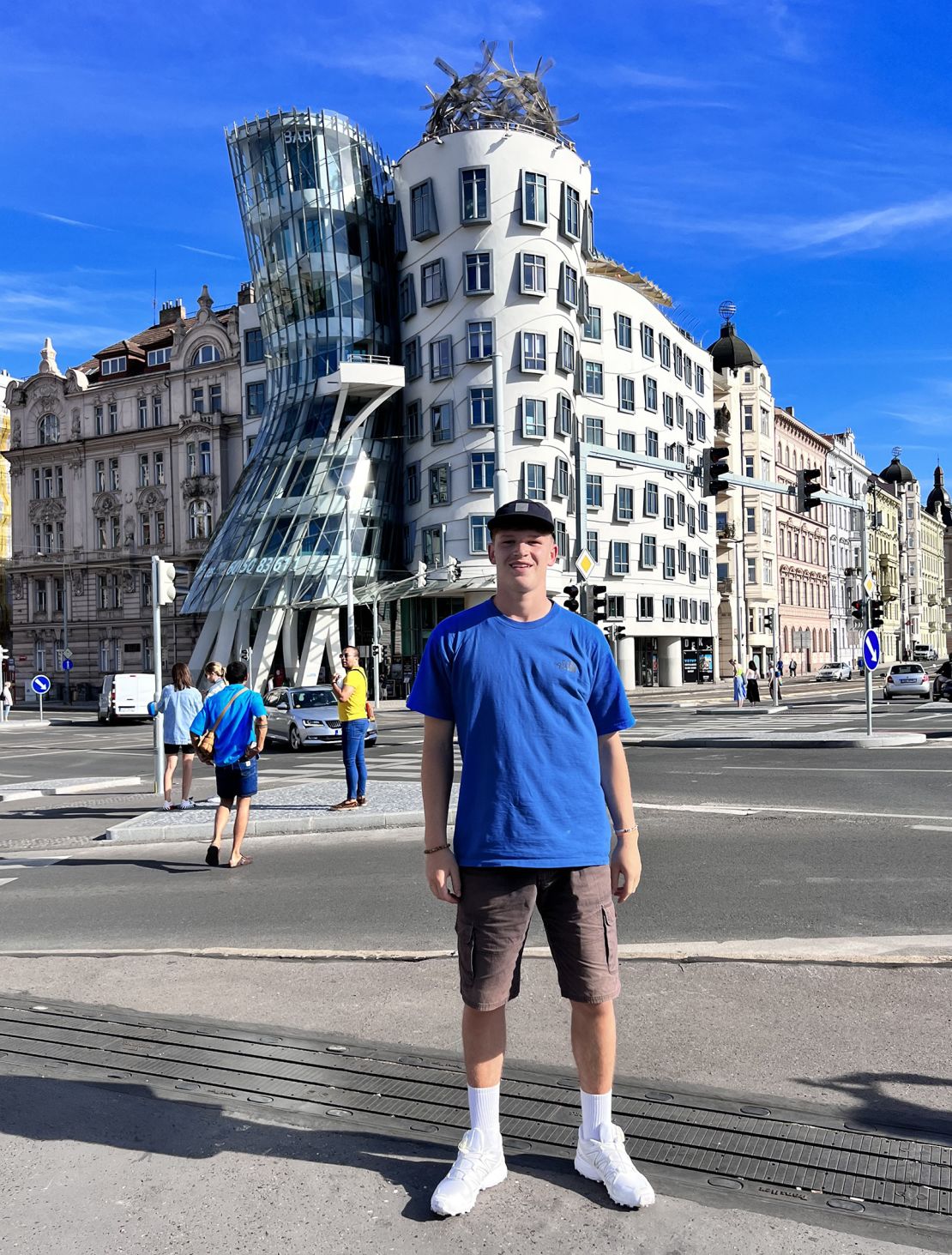 Kofi Landan traveled Europe by rail using the Interrail pass in 2022. Here he is outside the Dancing House in Prague in the Czech Republic.