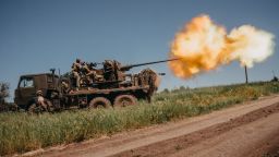Ukrainian soldiers shoot rounds into Russian positions outside Bakhmut, on June 19, 2023.