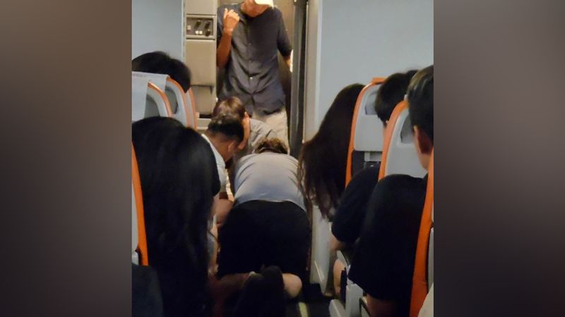 NextImg:South Korean man attempted to open plane door mid-flight. Luckily, he failed | CNN