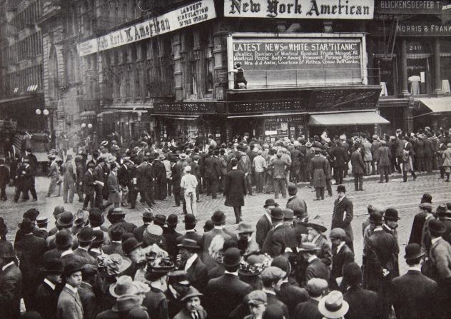 <strong>The shocking news:</strong> Reports of the sinking of the Titanic arrive in New York. As the news of the disaster spread, people gathered around newspaper bulletin boards. 