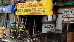 The charred remains of the e-bike repair and sales store on Madison St. in the Chinatown area of Manhattan early Tuesday. 