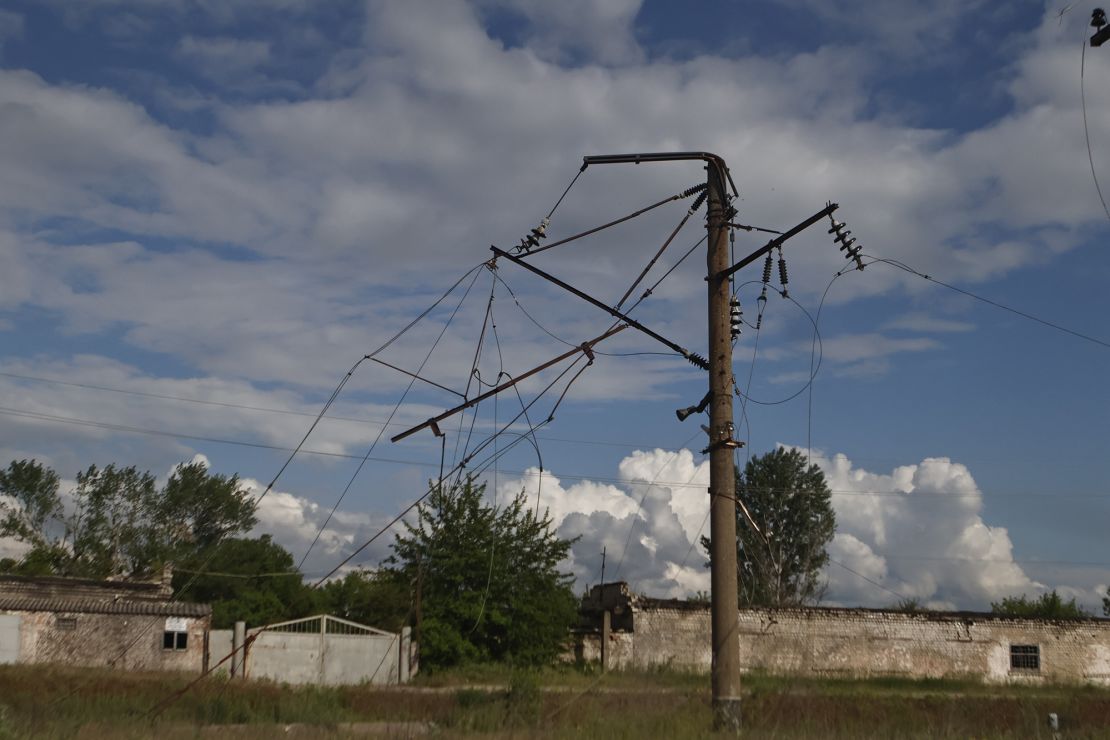 An electricity pylon and power lines in Kupiansk, Ukraine, damaged by shelling on May 23, 2023