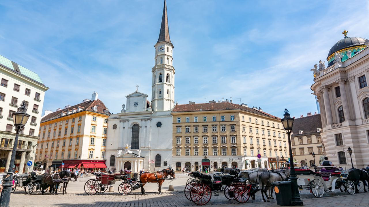 Horse carriages on St. Michael square (Michaelerplatz), Vienna, Austria