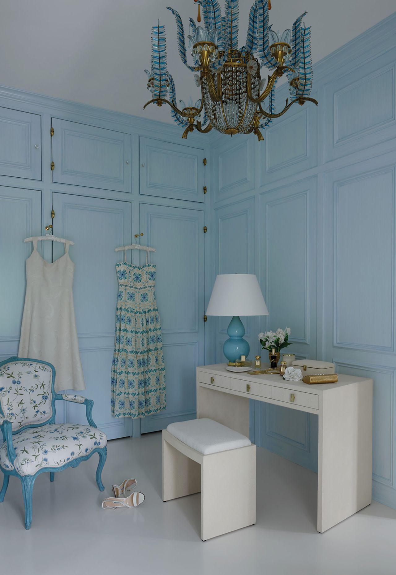 Pale blue accents — a nod to the Esteé Lauder brand — appears throughout the home.