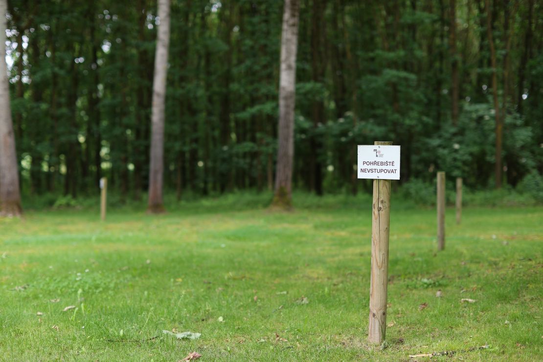 A sign "Burial grounds, do not enter" marks the site of mass graves discovered near the camp.