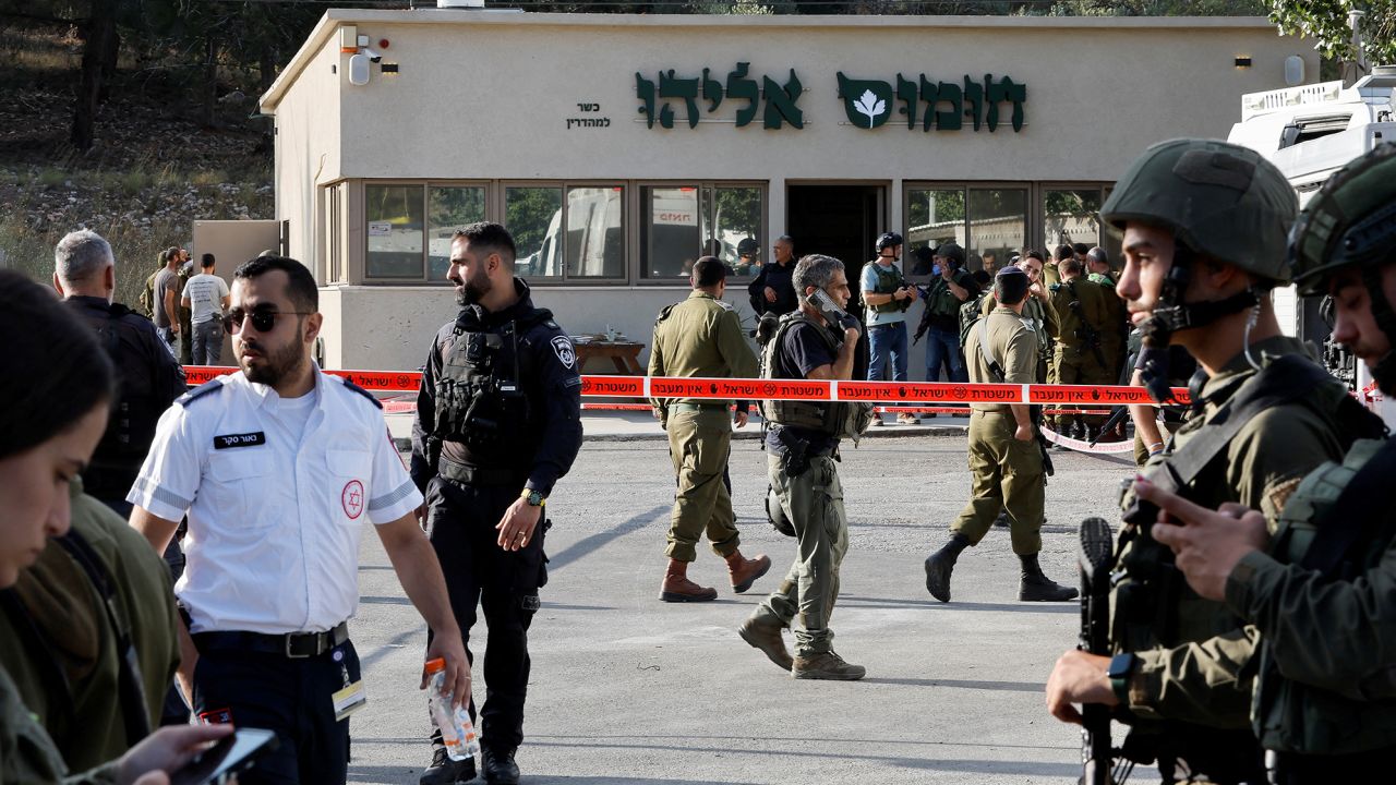 Security personnel work at the scene of a shooting attack that killed four Israelis near the Jewish settlement of Eli on June 20, 2023. 
