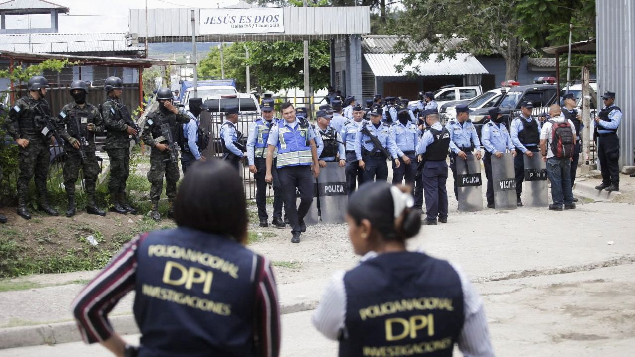 Security forces are seen outside the Centro Femenino de Adaptacion Social women prison following a deadly riot.
