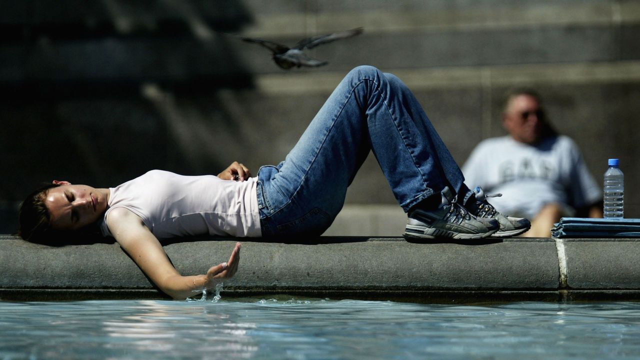 A girl cools off in July 2003 near a fountain in Trafalgar Square in London as a scorching heat wave hits Europe.