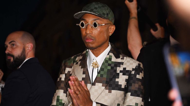 US Louis Vuitton' fashion designer and singer Pharrell Williams acknowledges the audience at the end of the Louis Vuitton Menswear Spring-Summer 2024 show as part of the Paris Fashion Week on the Pont Neuf, central Paris, on June 20, 2023. (Photo by STEFANO RELLANDINI / AFP) (Photo by STEFANO RELLANDINI/AFP via Getty Images)