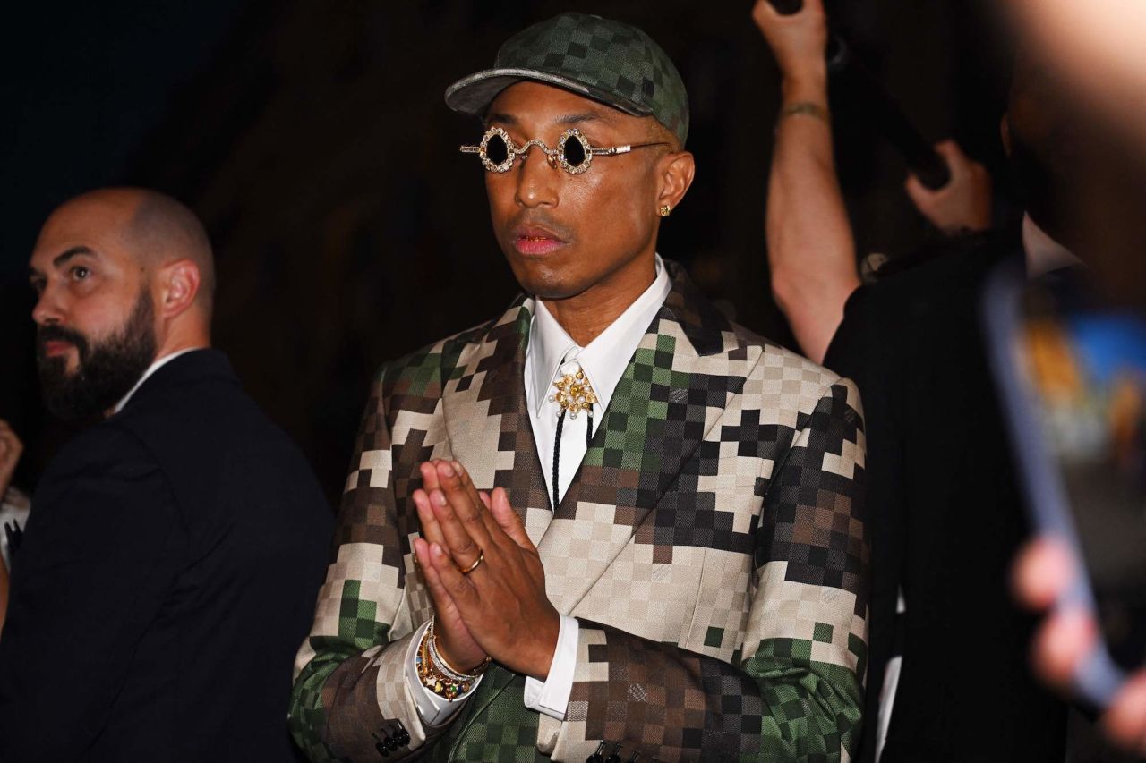 US Louis Vuitton' fashion designer and singer Pharrell Williams acknowledges the audience at the end of the Louis Vuitton Menswear Spring-Summer 2024 show as part of the Paris Fashion Week on the Pont Neuf, central Paris, on June 20, 2023. (Photo by STEFANO RELLANDINI / AFP) (Photo by STEFANO RELLANDINI/AFP via Getty Images)