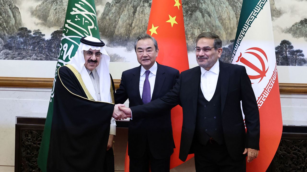 Wang Yi, a member of the Political Bureau of the Communist Party of China, Ali Shamkhani, then secretary of Iran's Supreme National Security Council, and Minister of State and national security adviser of Saudi Arabia Musaad bin Mohammed Al Aiban pose for pictures during a meeting in Beijing on March. 