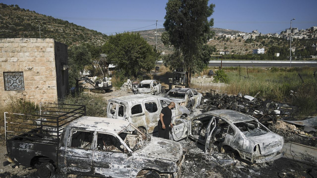 Scorched cars, including some junked for spare parts, left in the West Bank village of Al-Lubban ash-Sharqiya on June 21, 2023. 