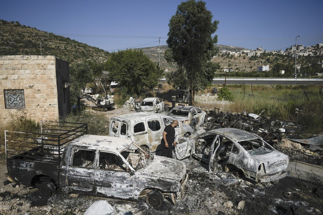 Scorched cars, including some junked for spare parts, left in the West Bank village of Al-Lubban ash-Sharqiya on June 21, 2023. 